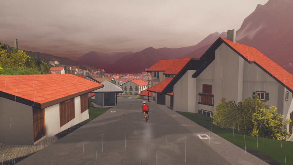 Rain coming down over Mittenwald in the morning: the road wet and shining, cloud on the Karwendel and the town below