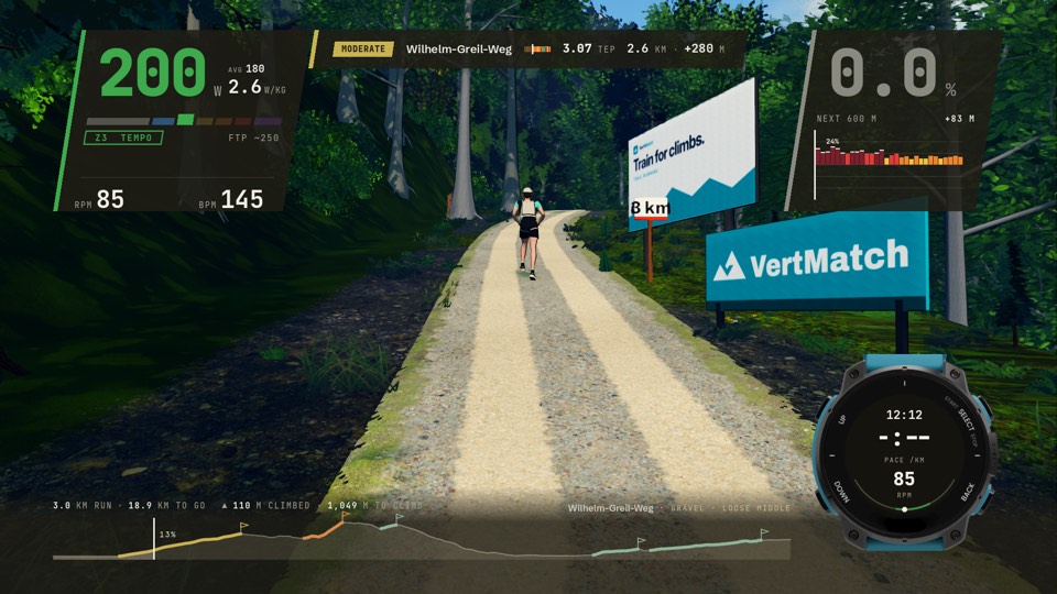 K110 stage one: a runner on a gravel forest road on the Wilhelm-Greil-Weg climb above Innsbruck, its card rating it Moderate at 3.07 TEP, VertMatch boards by the track